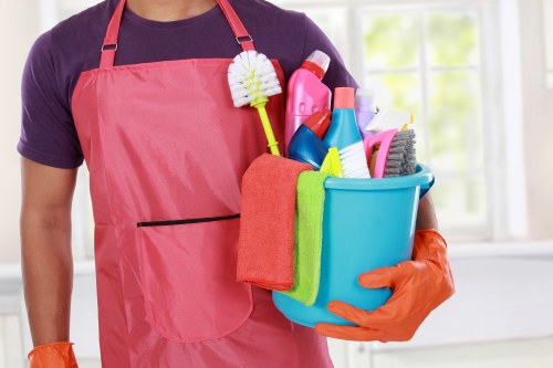Professional cleaner reviewing safety procedures in a tidy workspace