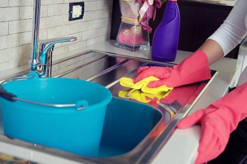Cleaner preparing a guest-ready bedroom during an Airbnb clean